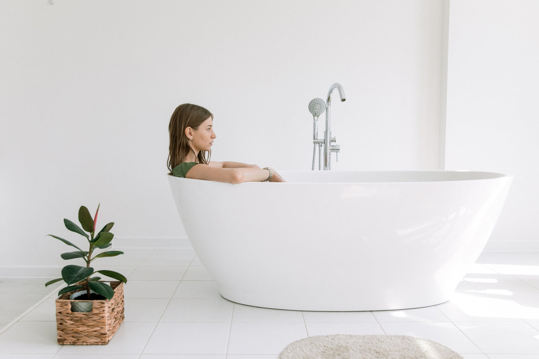 photo of woman on bathtub